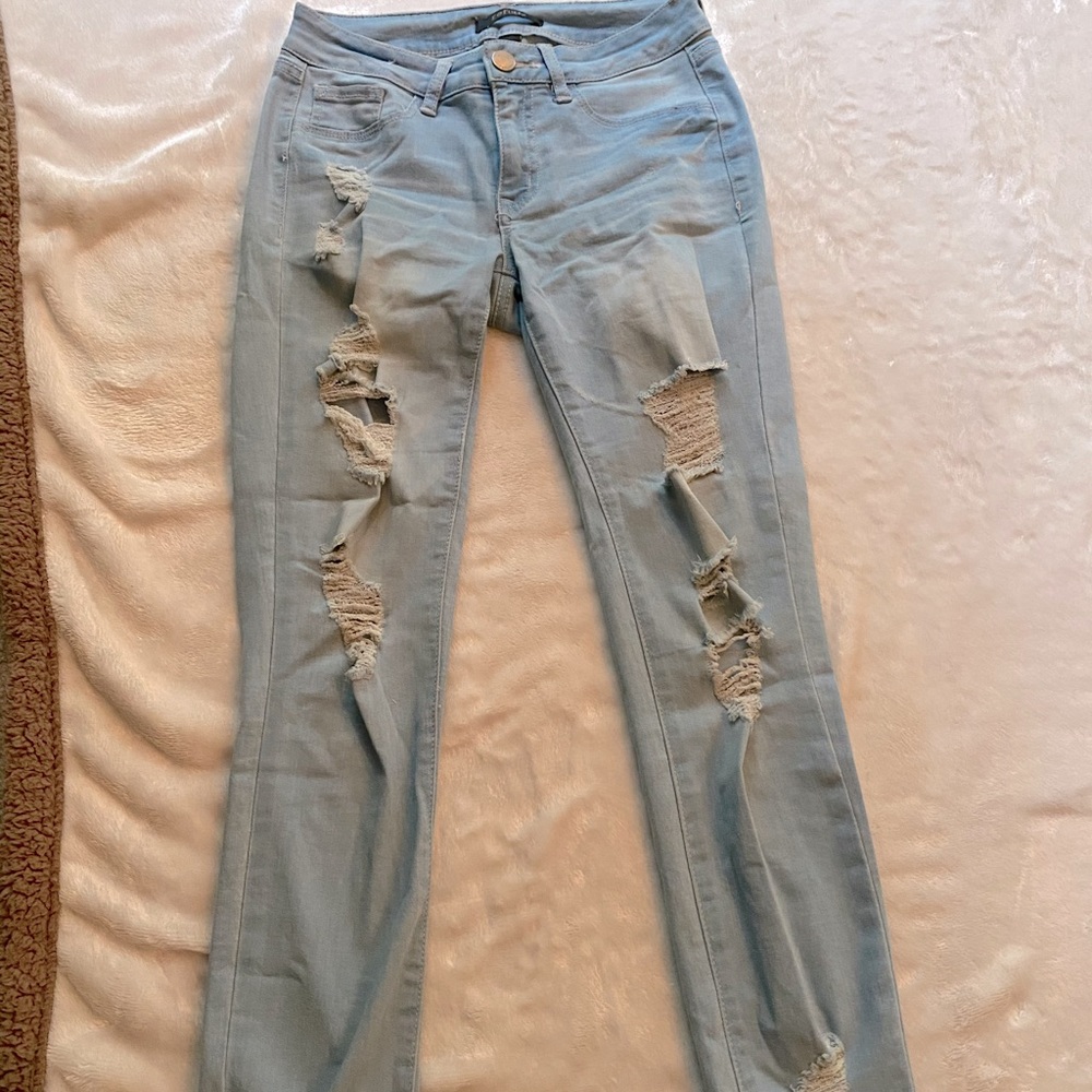 Light blue distressed jeans